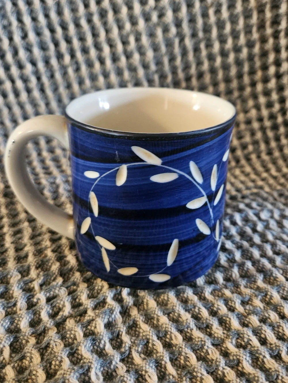 Blue Ceramic Coffee Mug with White Leaf Accent